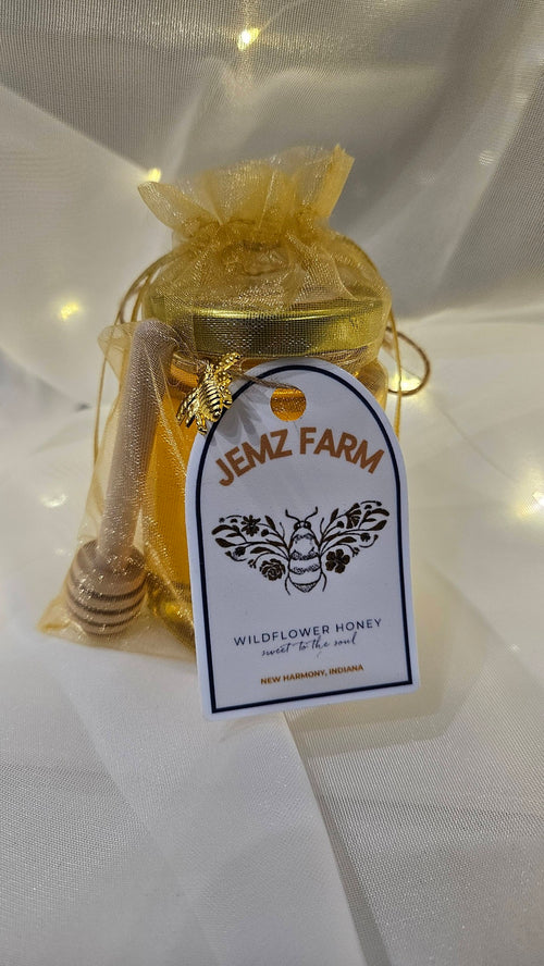 Jar of honey with a 'Jenz Farm' label on a white background