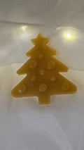 Decorative Christmas lights shaped like gingerbread men, trees, and other festive items on a white background.