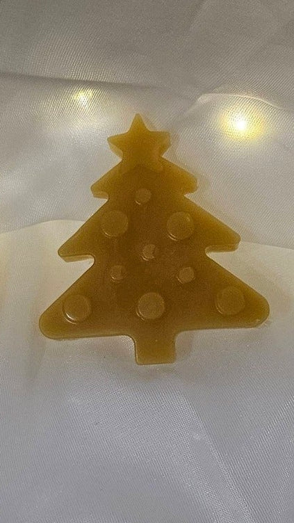 Decorative Christmas lights shaped like gingerbread men, trees, and other festive items on a white background.